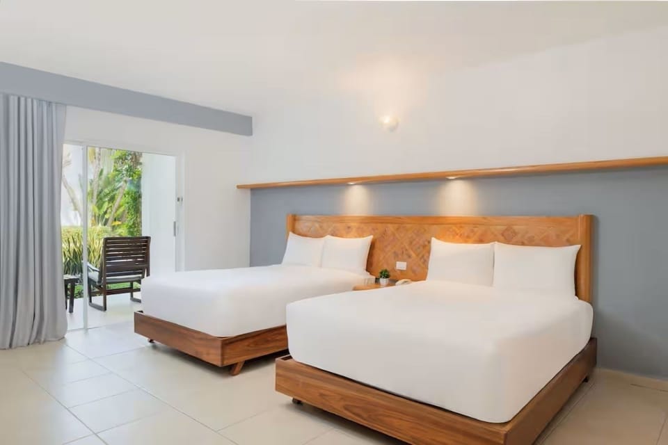 Unwind in airy twin beds beside your private terrace.