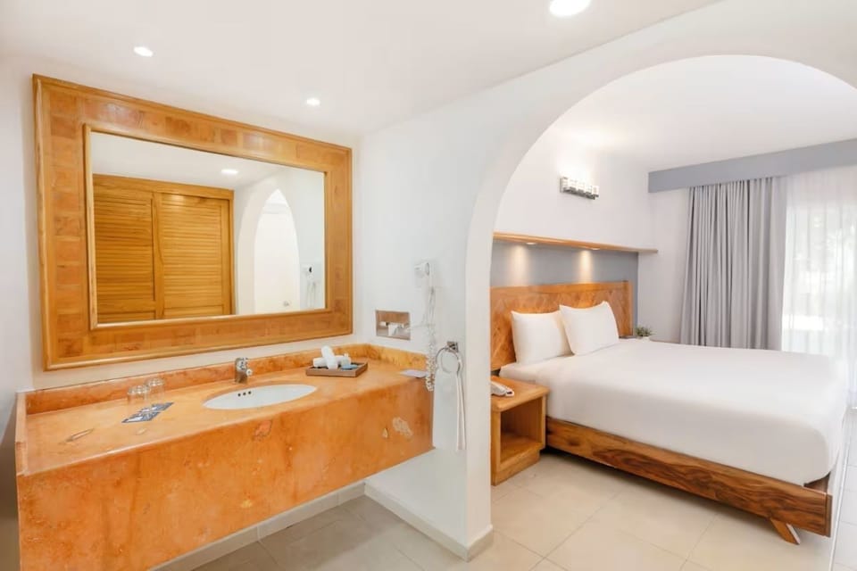 Unwind in a bright suite with spa-style vanity convenience.