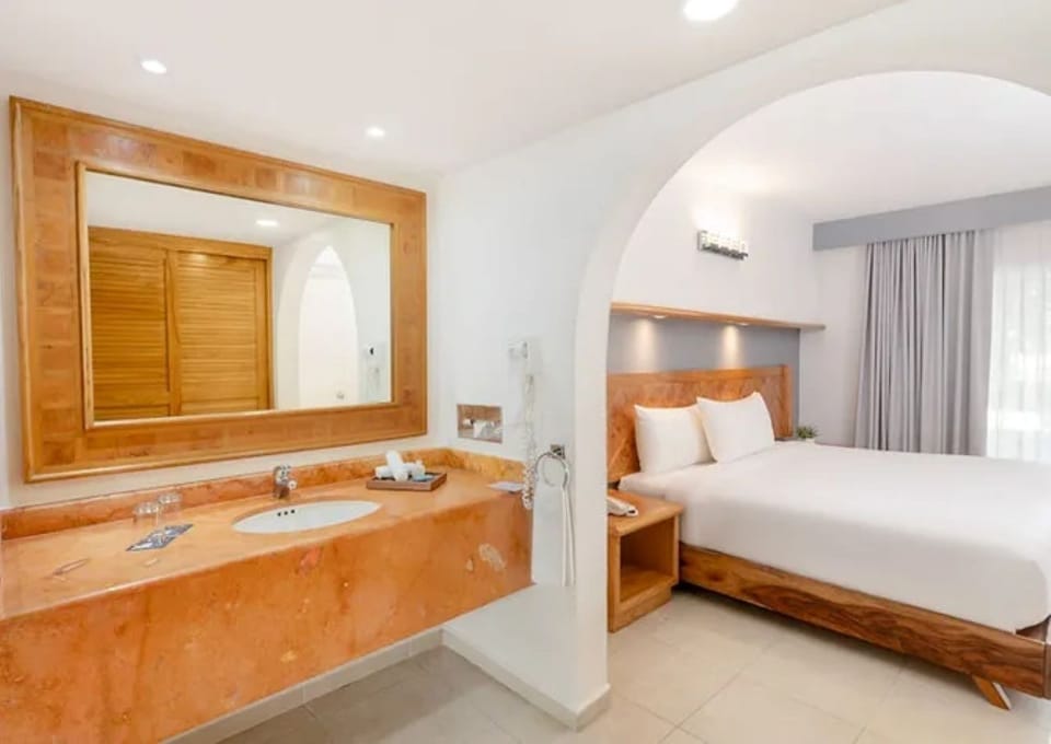Relax in a bright suite with warm wood accents nearby.