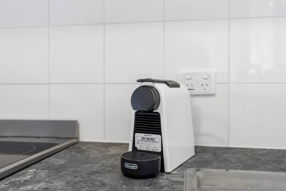 A Nespresso machine, kettle and toaster support a relaxed morning routine, providing fresh coffee and quick breakfasts whenever you like.