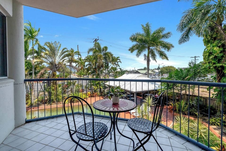 The private balcony provides a tranquil perch for morning coffee or sunset drinks surrounded by gentle tropical breezes.