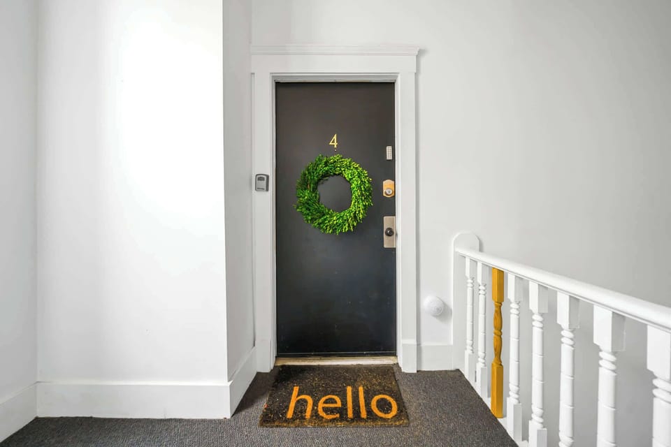 A warm welcome awaits behind Door 4—your urban retreat with a personal touch.