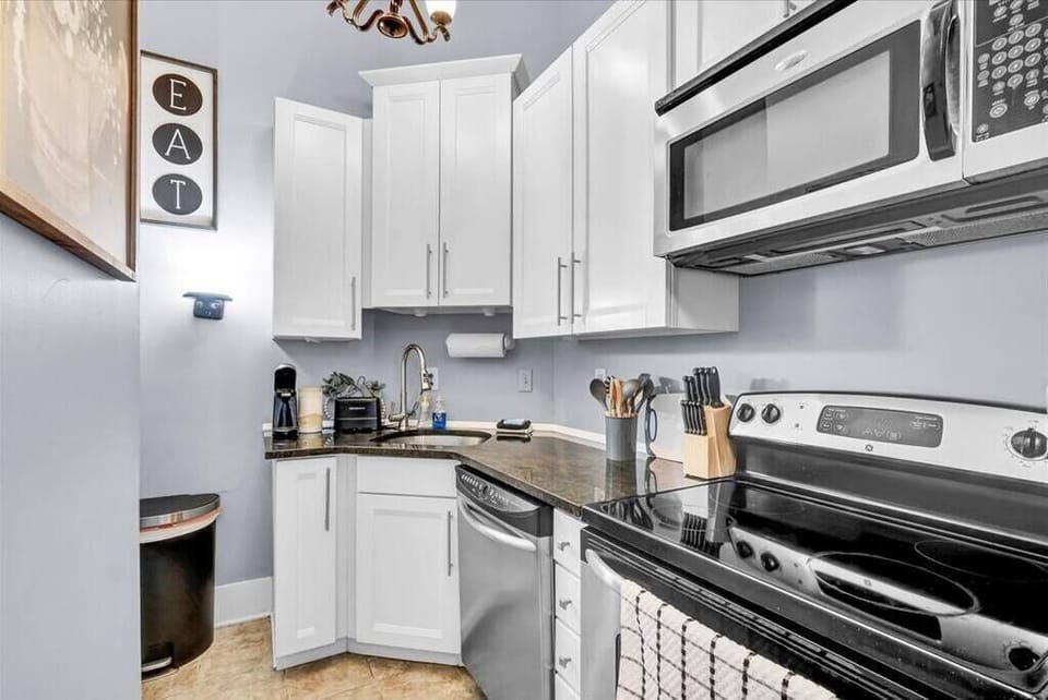 Fully-equipped kitchen with all the essentials for a cozy meal at home.