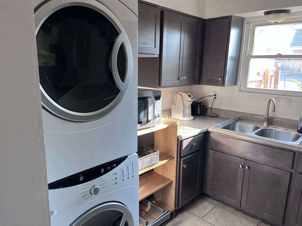 Kitchen: Get the best of both worlds with our kitchen and laundry room hybrid design, offering functionality and convenience.