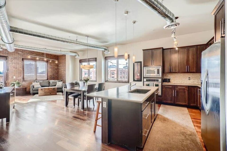 Kitchen: Our apartment features a spacious and open layout, with no walls separating the kitchen, living room, and dining area.