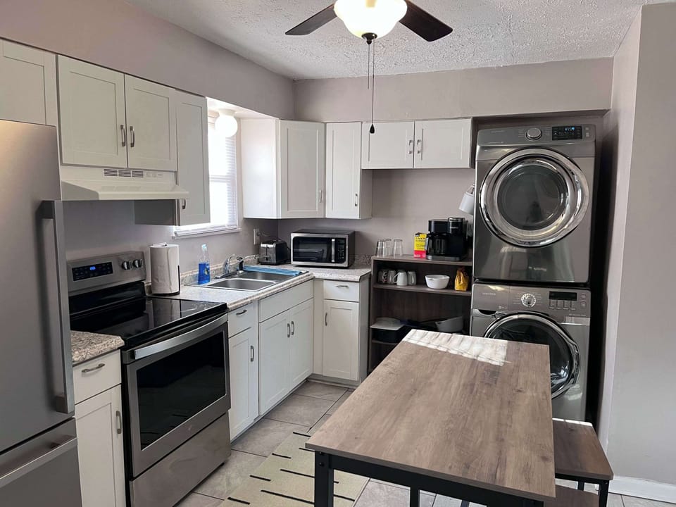 Kitchen: It's fully equipped with new appliances and kitchen utensils, making meal preparation for your loved ones easy during your stay. Plus, our unique kitchen and laundry room combo lets you efficiently cook while taking care of your laundry.
