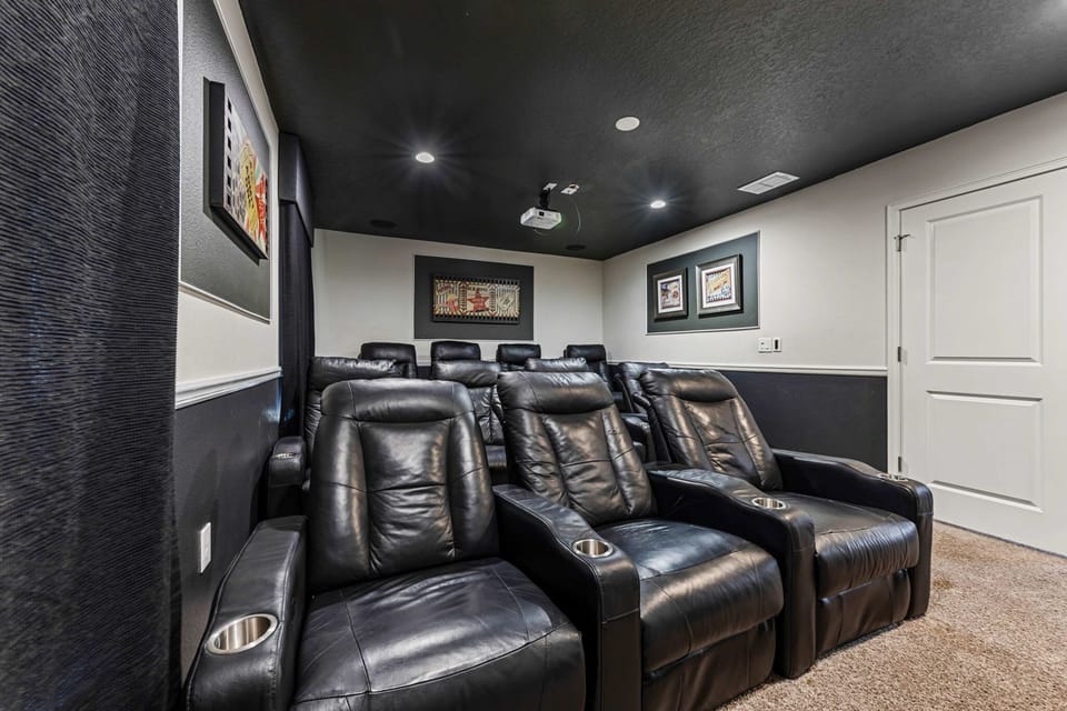 Your own private theater with plush seating and a massive screen, ideal for popcorn-filled movie nights or binge-watching favorites.