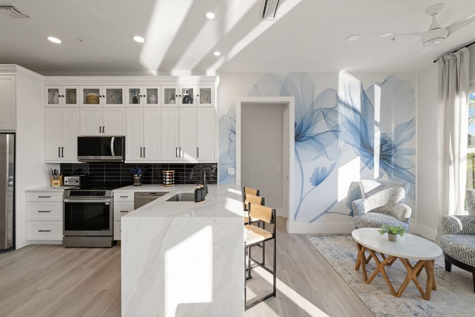 Bright kitchen with high-end appliances and island seating