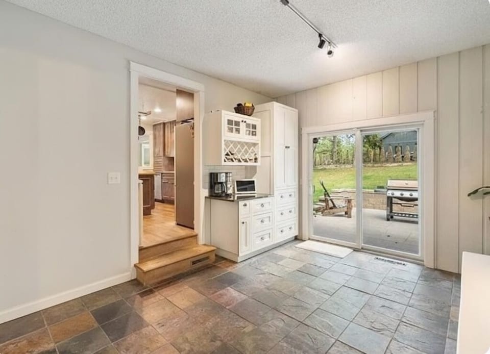 Spacious mud room between garage and kitchen