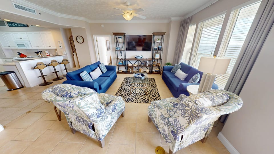 Bright and spacious living room with Gulf View and sleeper sofa.