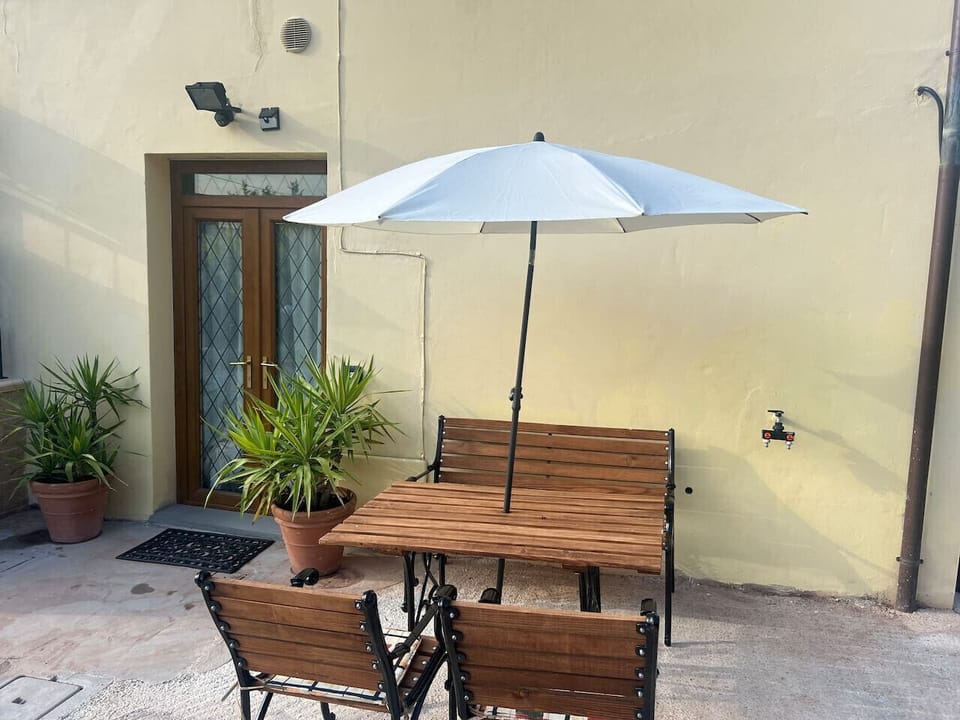 Shaded dining area perfect for relaxing afternoons