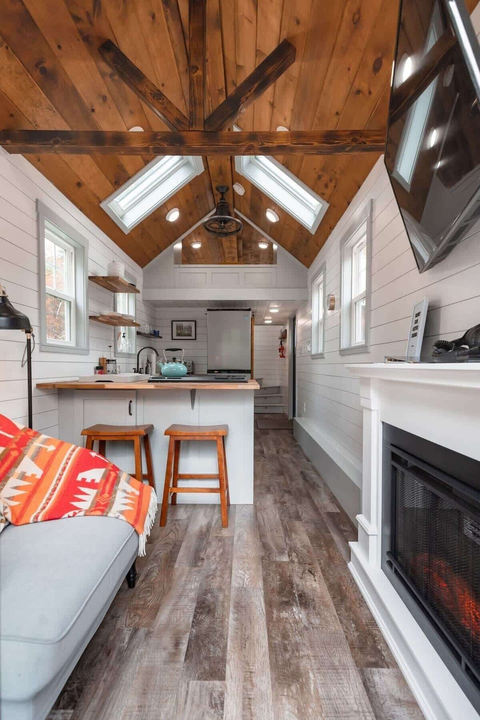 Our main floor. Complete with a full-sized kitchen, reading nook, and fireplace.