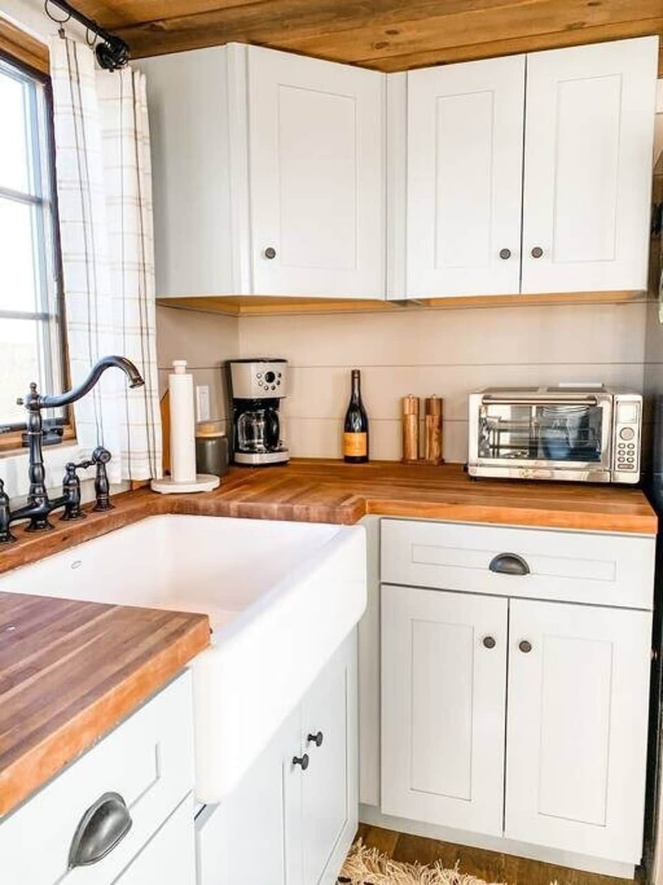 Farmhouse sink, butcher block countertops, and a full convection toaster oven