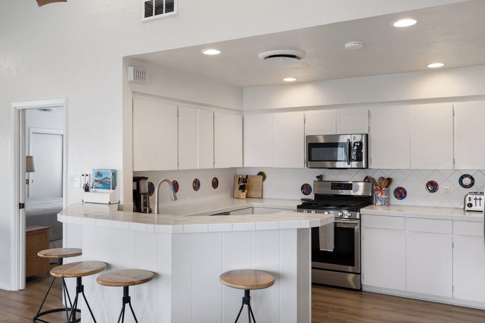 Thoughtfully stocked kitchen with high-quality tools and finishes.