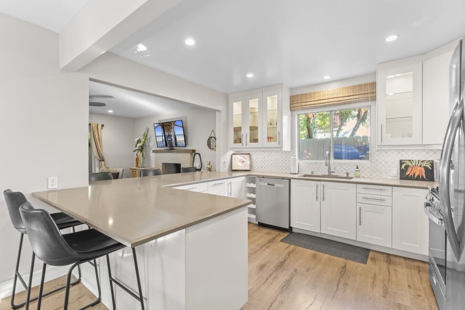 Open-concept kitchen with stainless appliances and generous counter space.