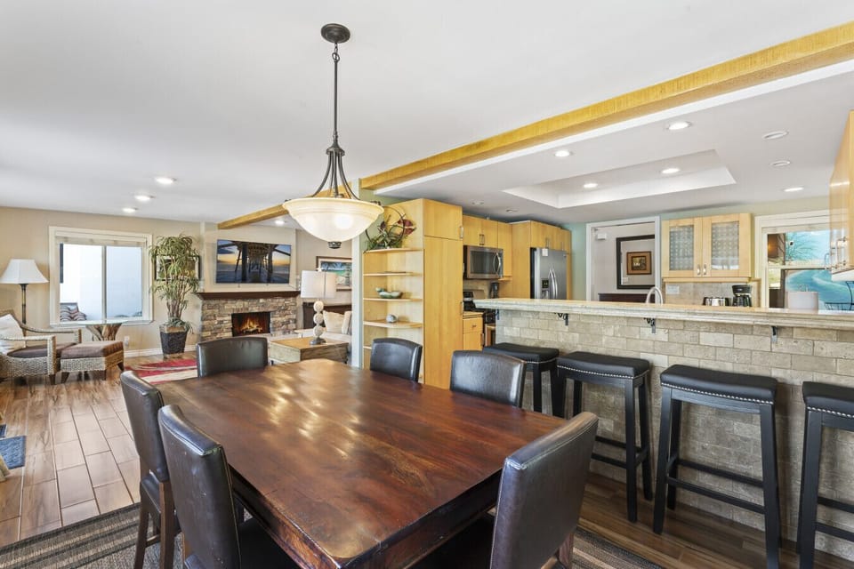 Open dining area with modern kitchen and living room