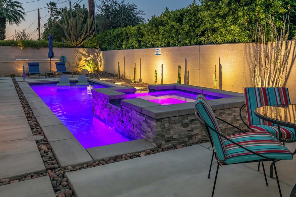 Resort-style pool and spa with LED lighting, waterfall & evening glow