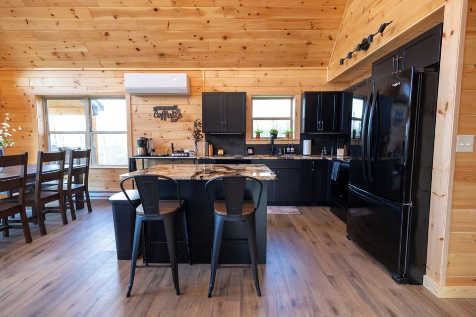 Open-concept kitchen with a spacious island and bar seating.