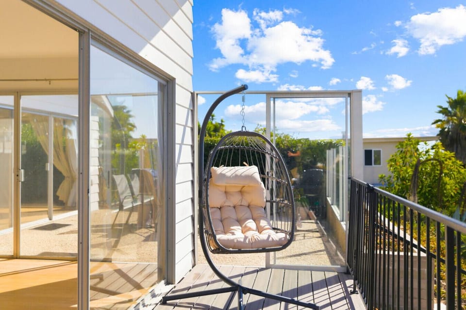 Relax and unwind in one of the two comfortable hanging chairs on the balcony.