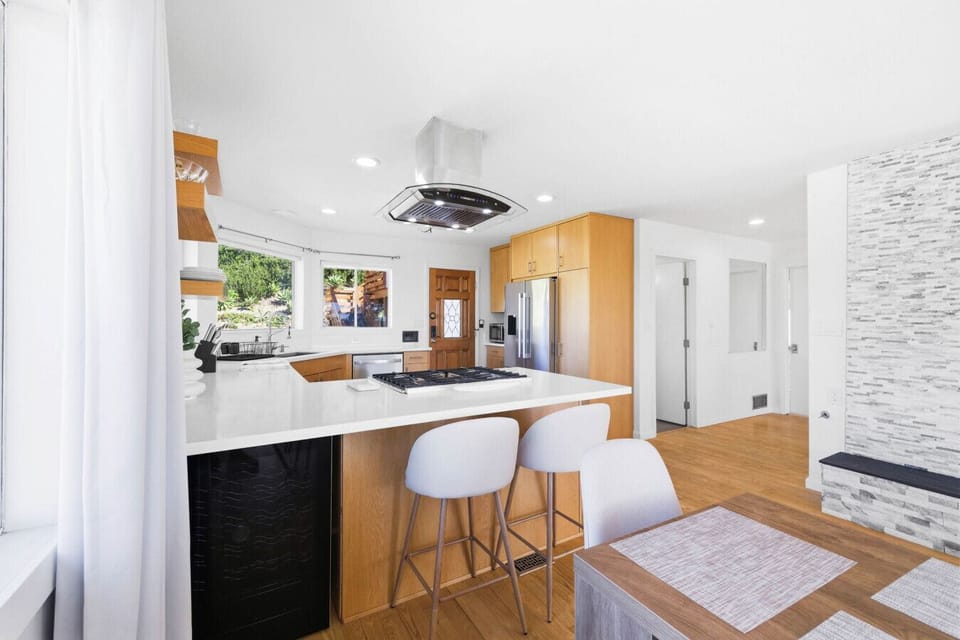 A clean, bright kitchen with stainless steel appliances and a gas range provides everything you need to prepare meals during your stay.