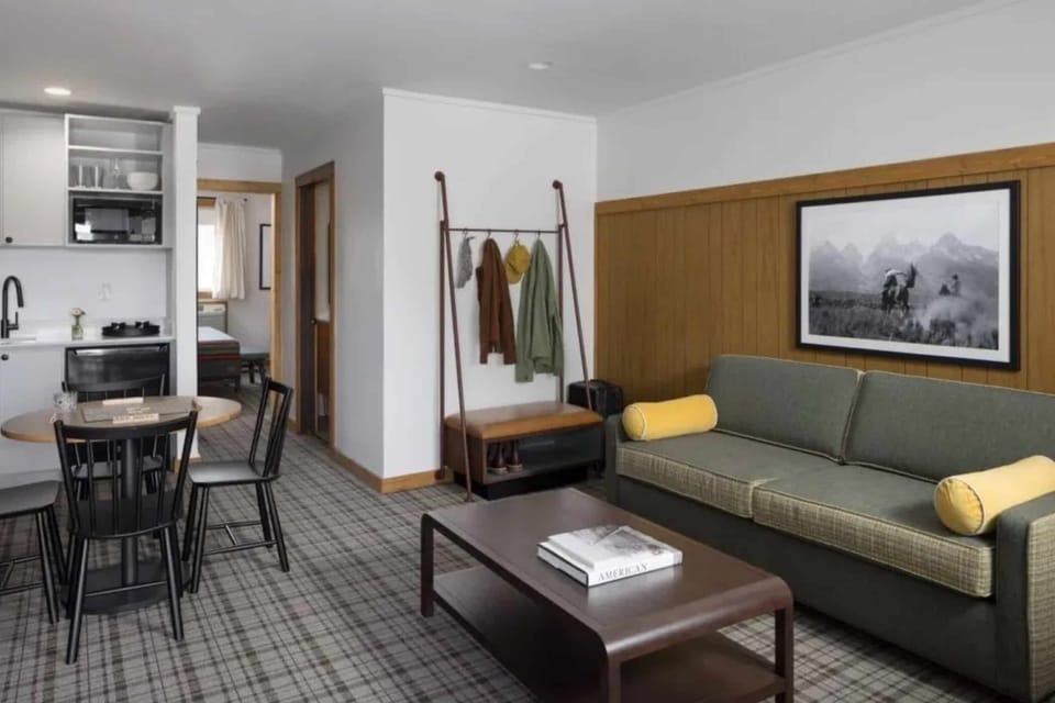 Relax in the open suite with comfortable seating and space.