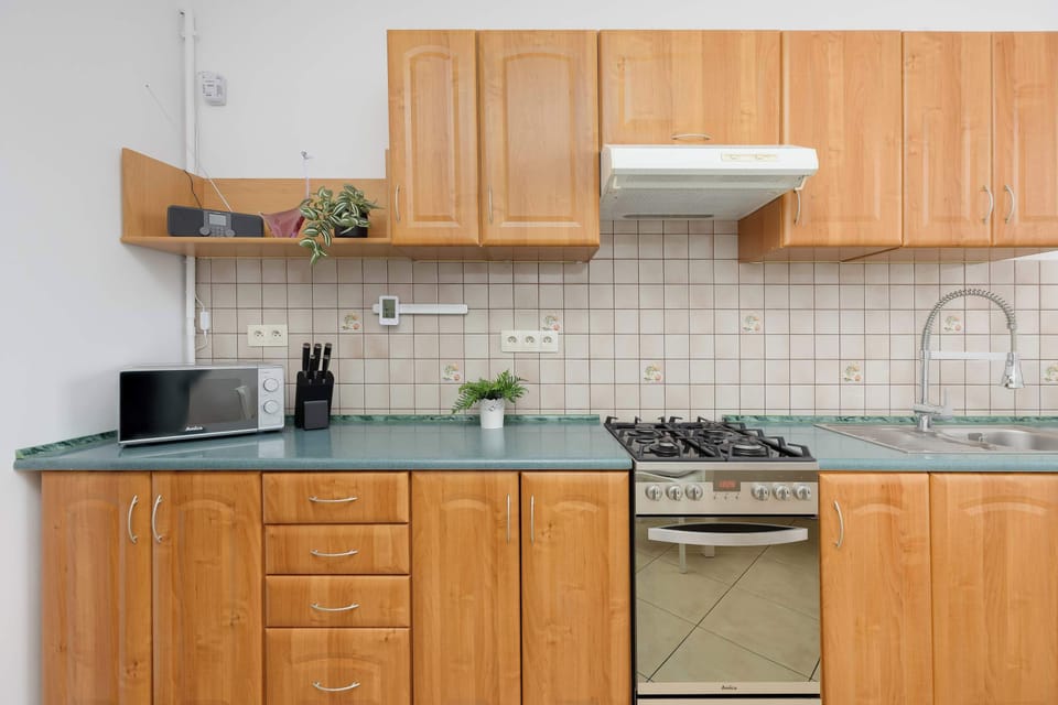 Fully equipped kitchen with all essentials for cooking during your stay.