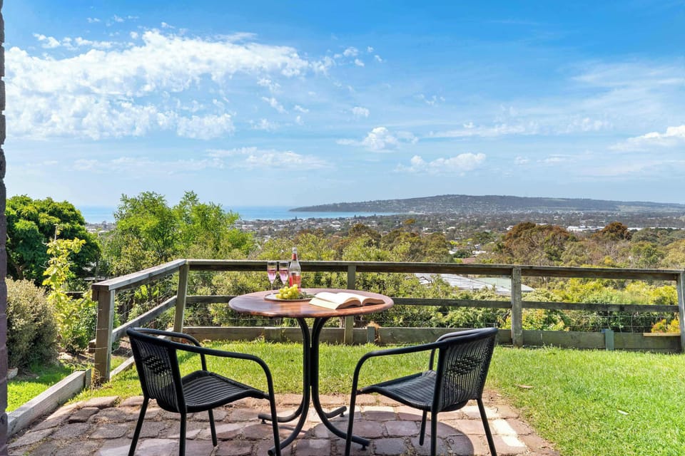 Serene balcony setting perfect for morning coffee or afternoon drink 