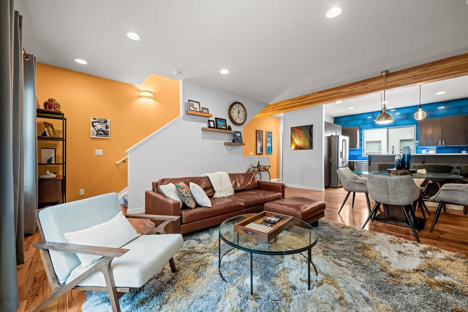 Contemporary living and dining space with abundant natural light—designed for long-term comfort
