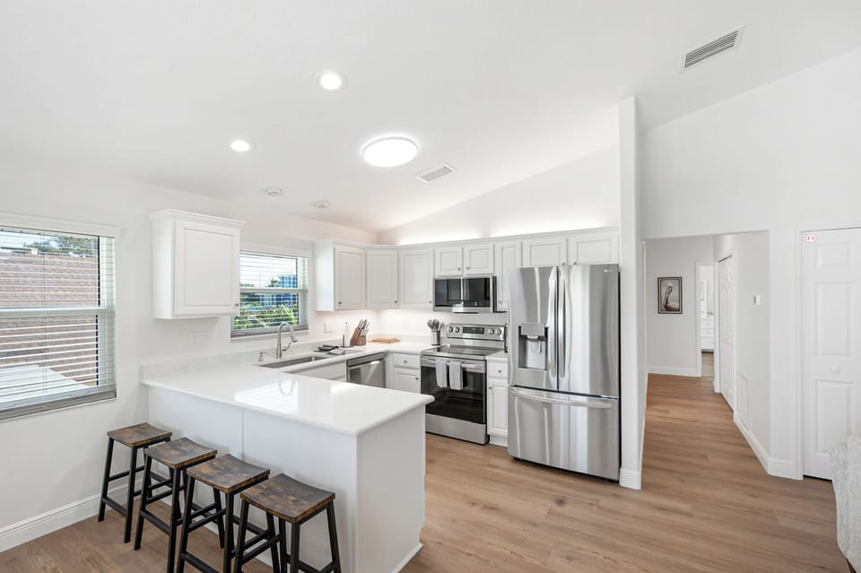 Updated kitchen with quartz counters and stainless appliances