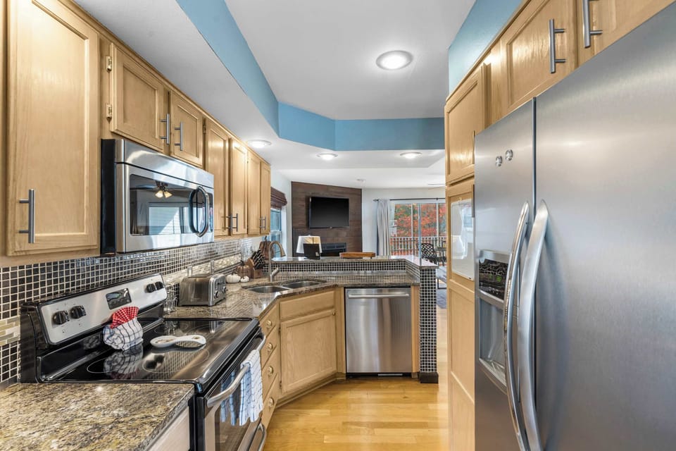 The open kitchen offers ample space & all the comforts of home​