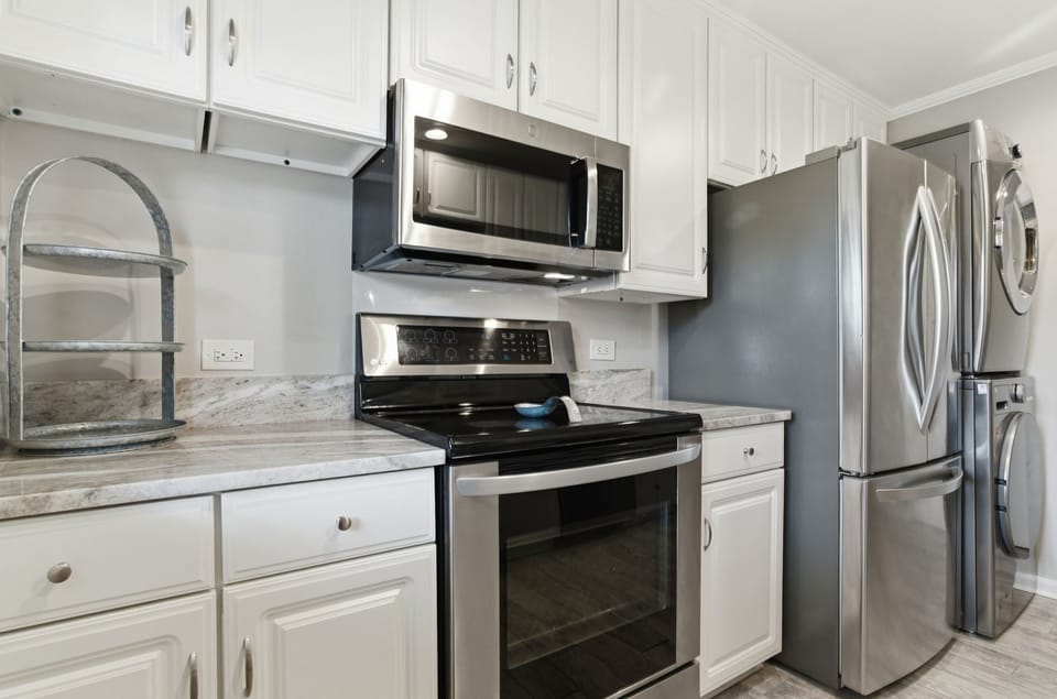 Your fully equipped kitchen features stainless steel appliances and granite countertops, perfect for preparing memorable meals during your stay.