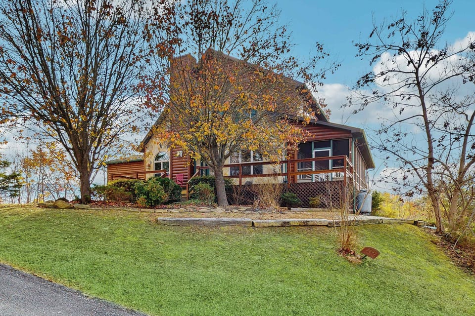 Nestled among trees, enjoy outdoor views and peaceful moments on the spacious deck!