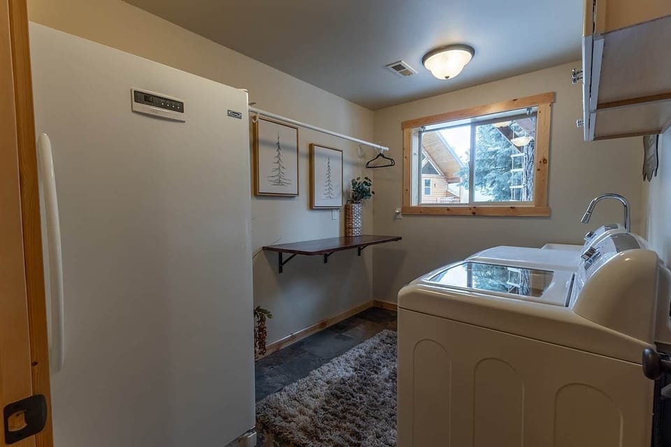 Well-appointed laundry room with all comforts of home and supplies provided for your convenience