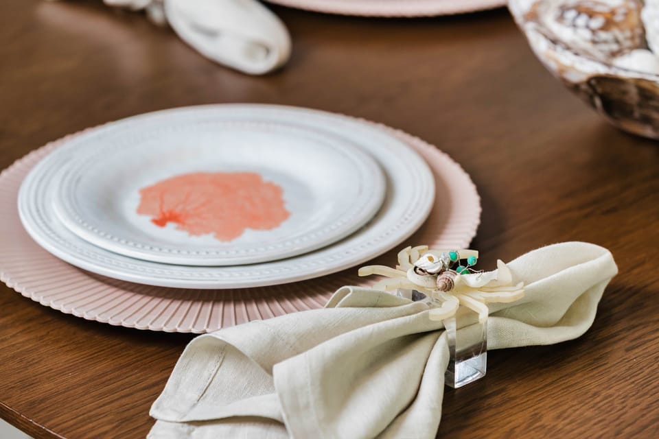 Elegant Dining Table Setting with Coastal Decor and Modern Dinnerware
