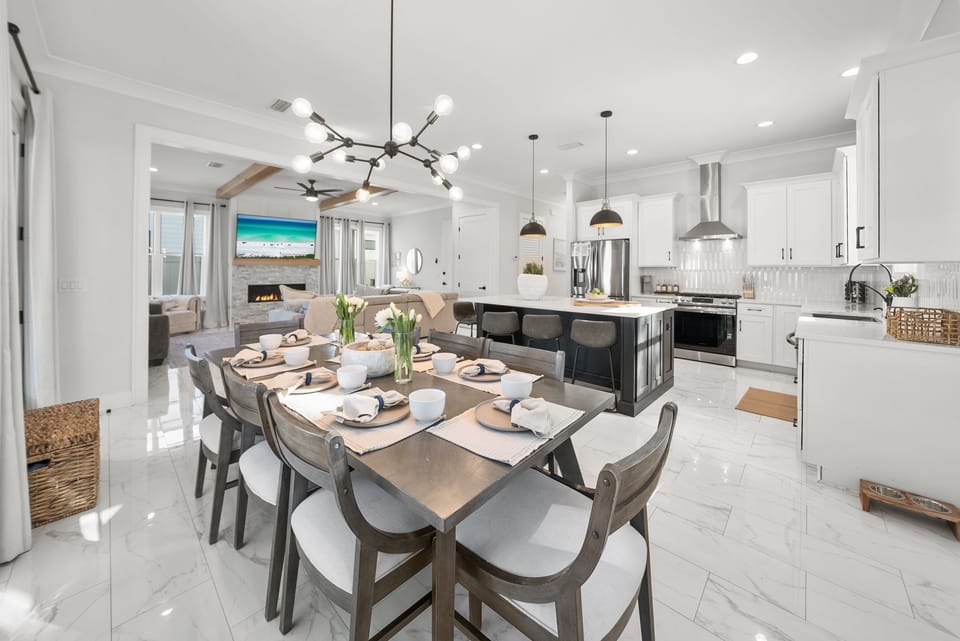 Open-concept kitchen and living space with an 8-person dining table.