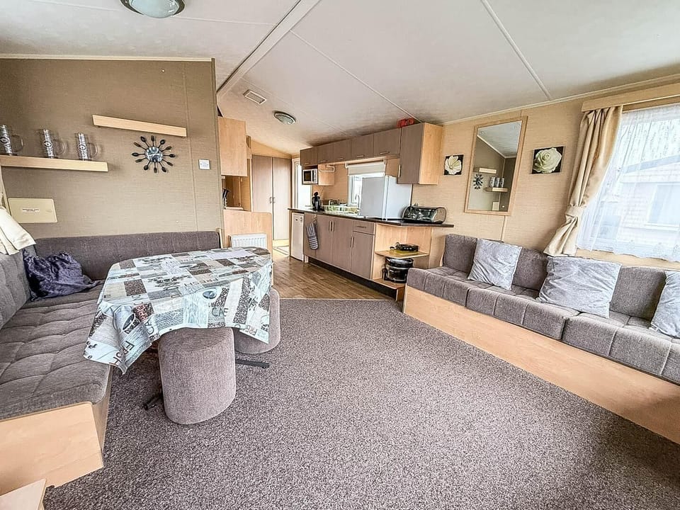 Enjoy moments together in this cosy living room. The kids have plenty of space to play whilst you kick back and relax on the sofa.