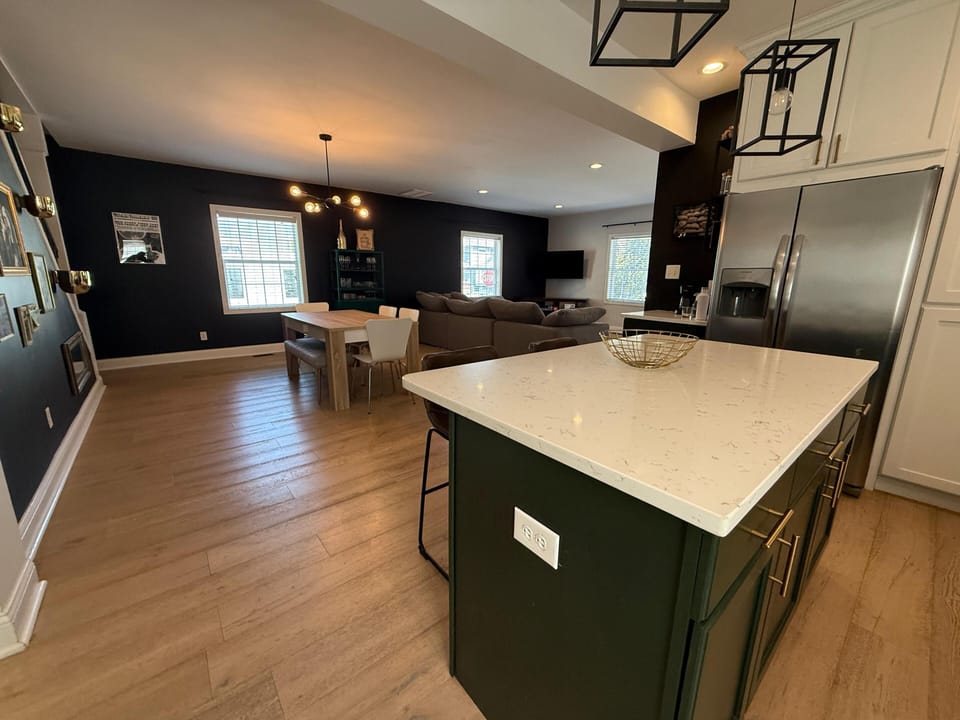 Fully equipped kitchen with stainless steel appliances for home meals.