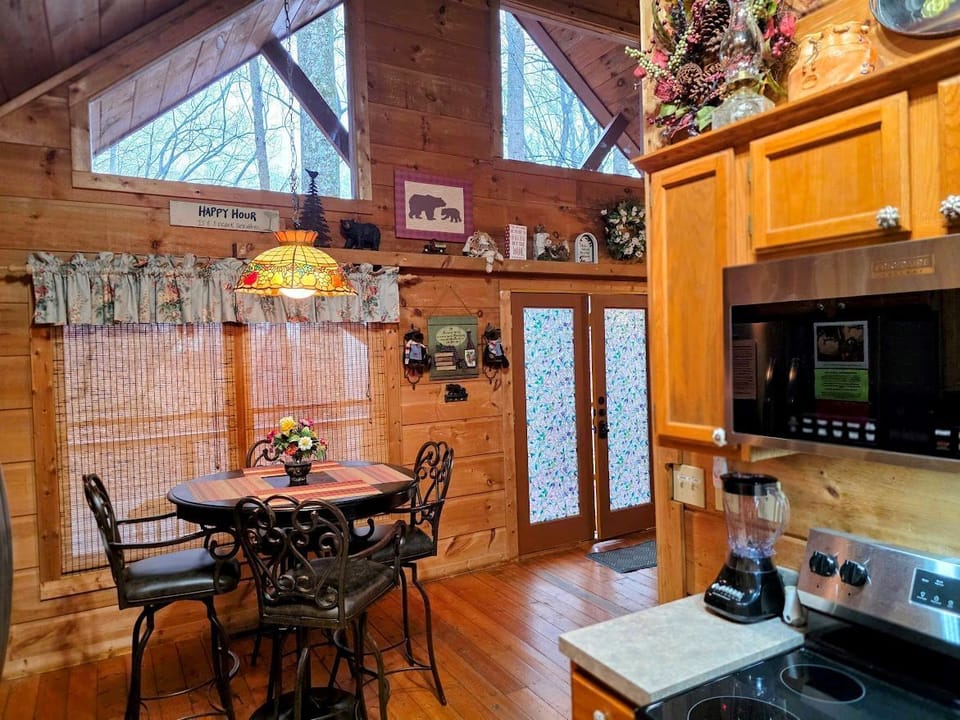 Dining area is just off the kitchen. The bar high table has 4 padded bar stools 