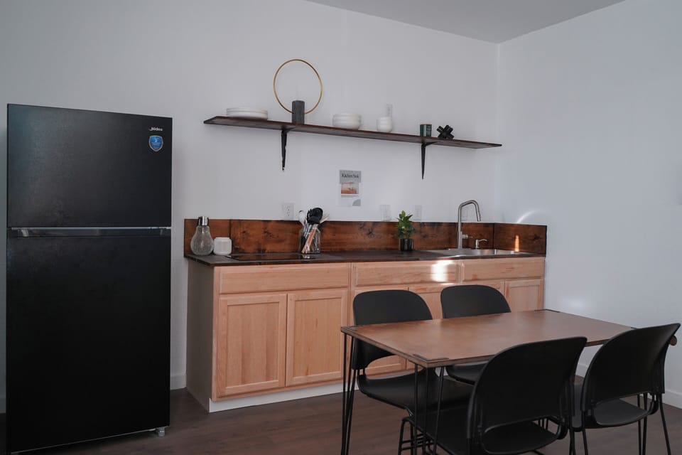 Full sink, full refrigerator and dedicated prep space.
