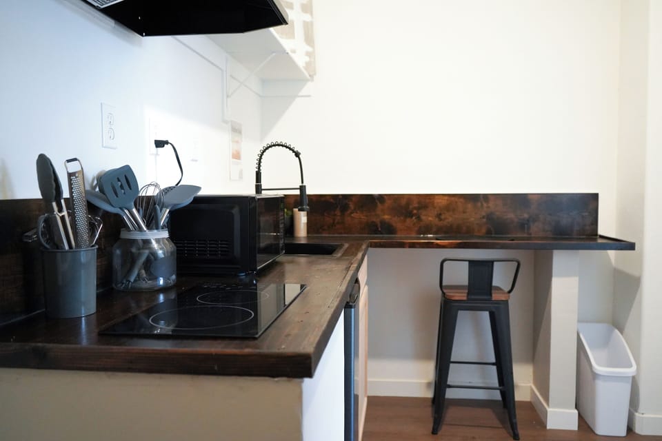 Cozy kitchenette with comfortable seating area.