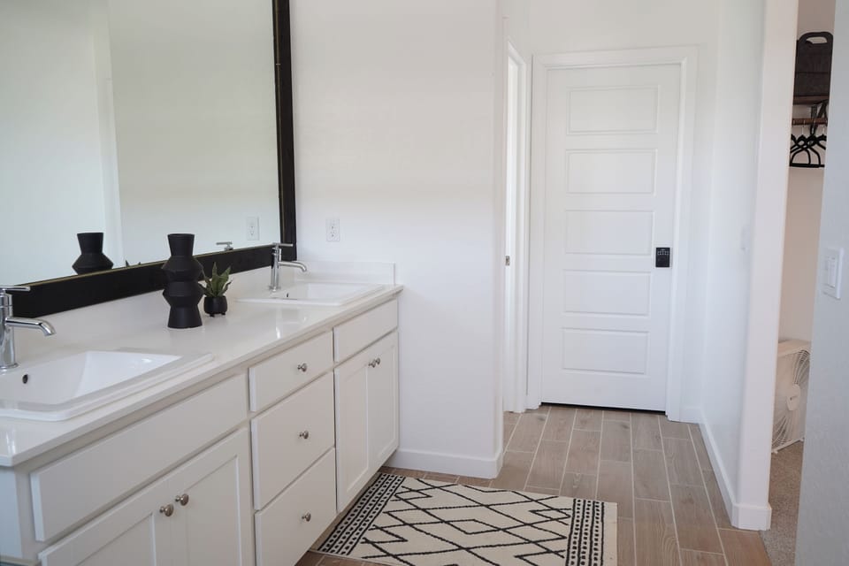 His and hers sink. Large mirror.
