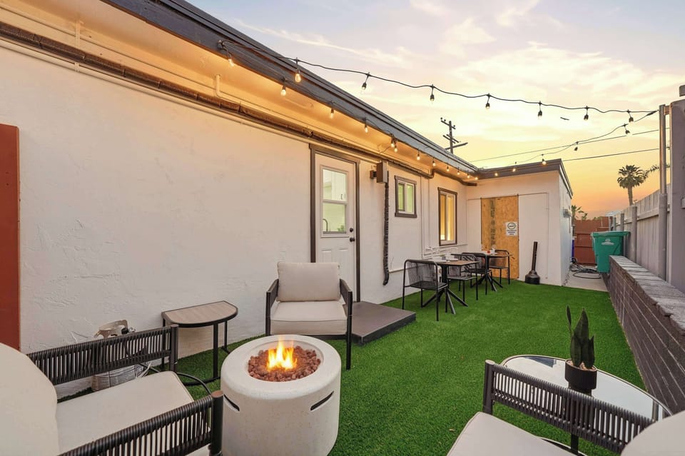 Evening patio setup with charming string lights and comfortable seating.