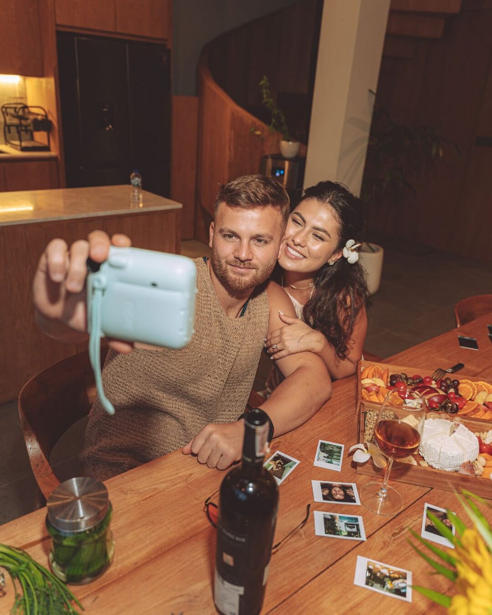 Capturing moments by using polaroid camera - villa satu 