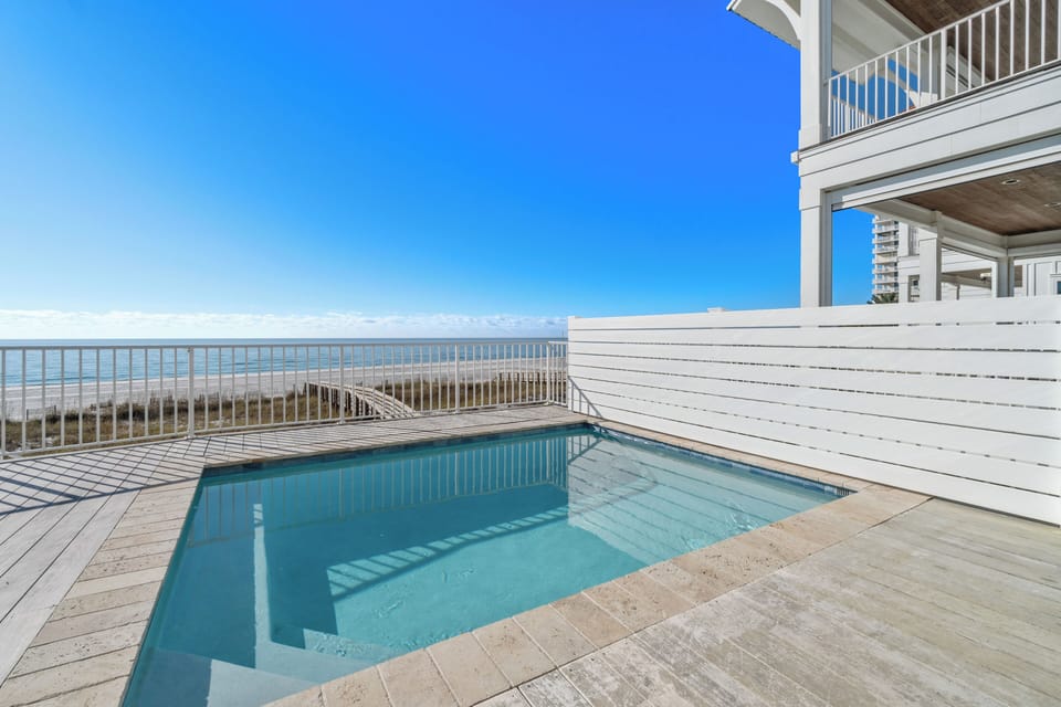 Beach front heated pool with privacy wall