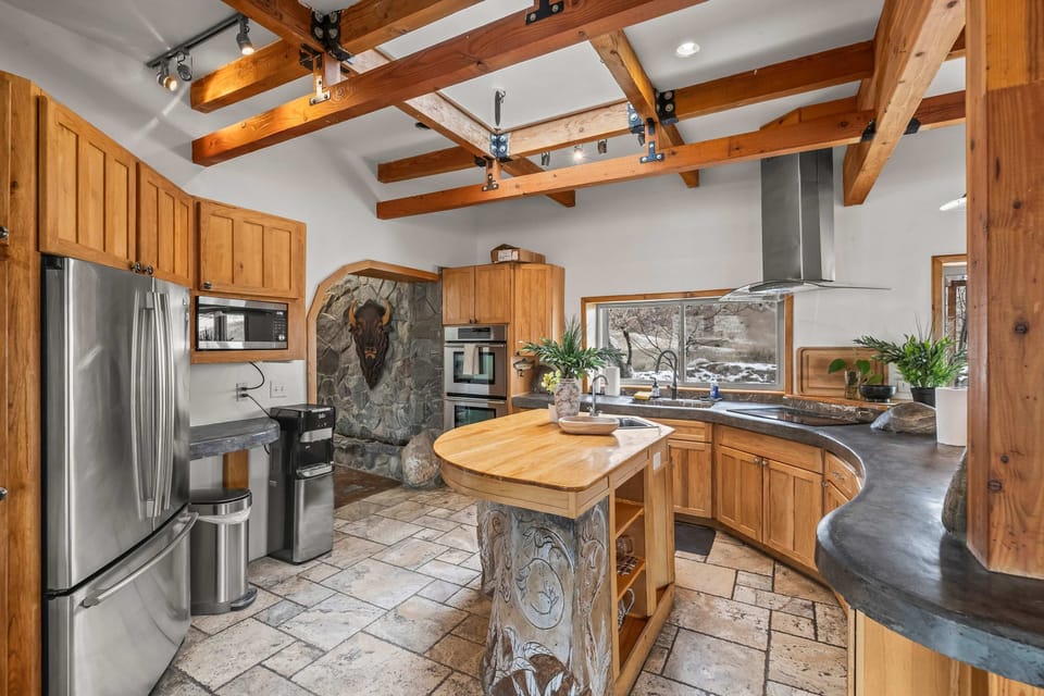 
Kitchen angle showing ample prep space and an easy flow into dining and living areas.