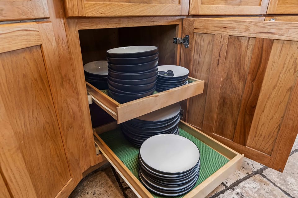 Open kitchen shelving keeps dishes organized & within reach