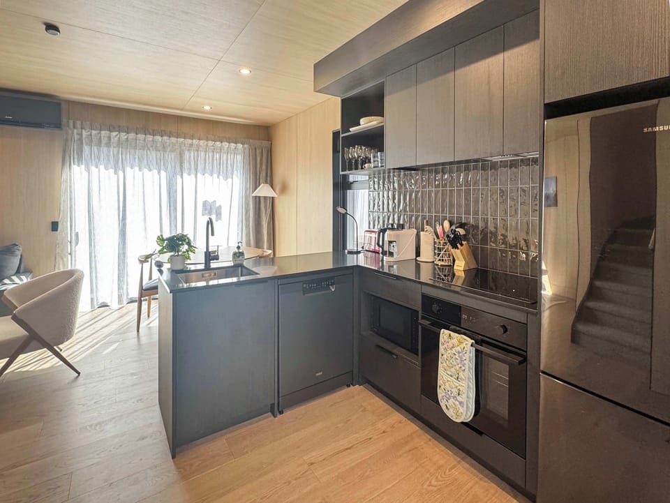 Modern kitchen with full amenities and polished design