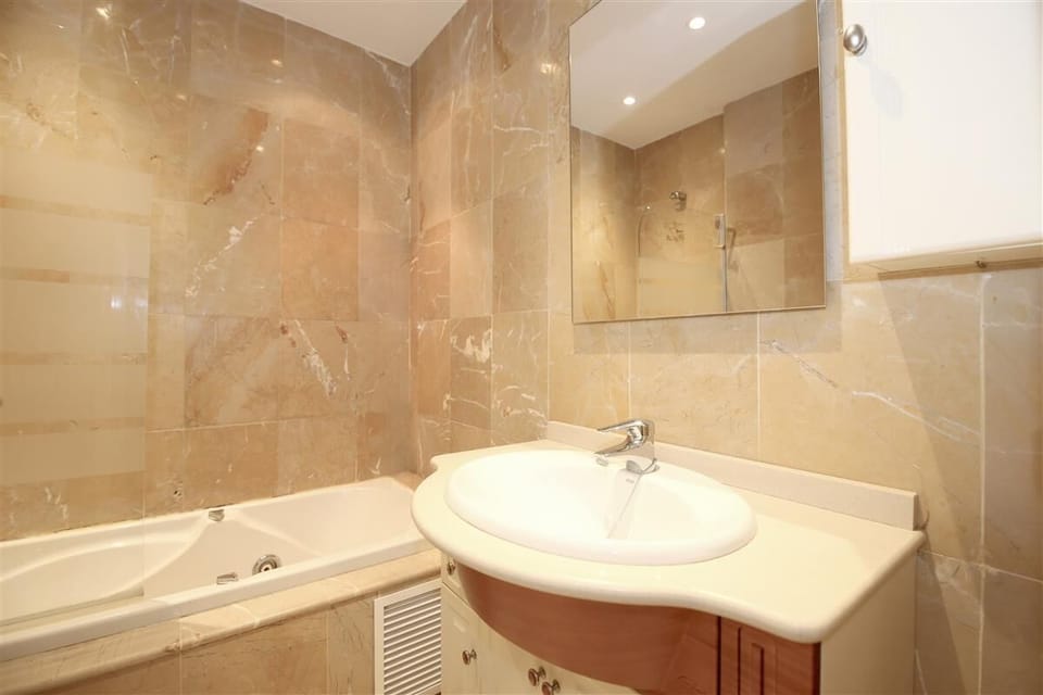 En-suite bathroom to the master bedroom with bath, shower, toilet, bidet and hand-basin