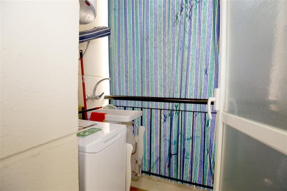 Laundry room located to an end of the kitchen