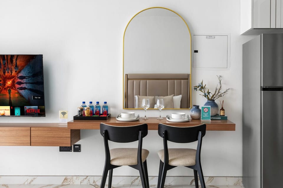Elegant dining setup with plates, cups, spoons, and a protective cloth for a tidy meal